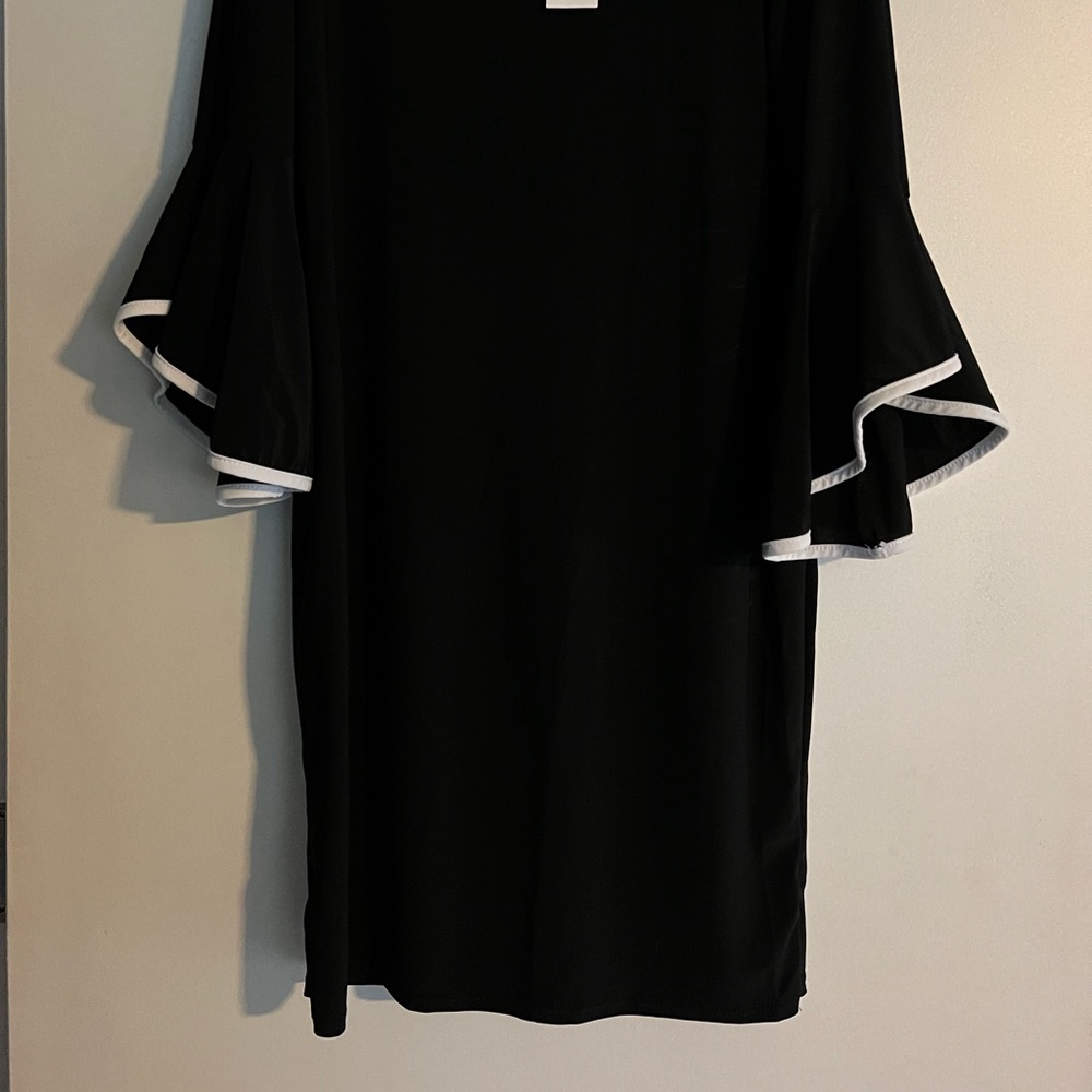 Black dress, with handbag.